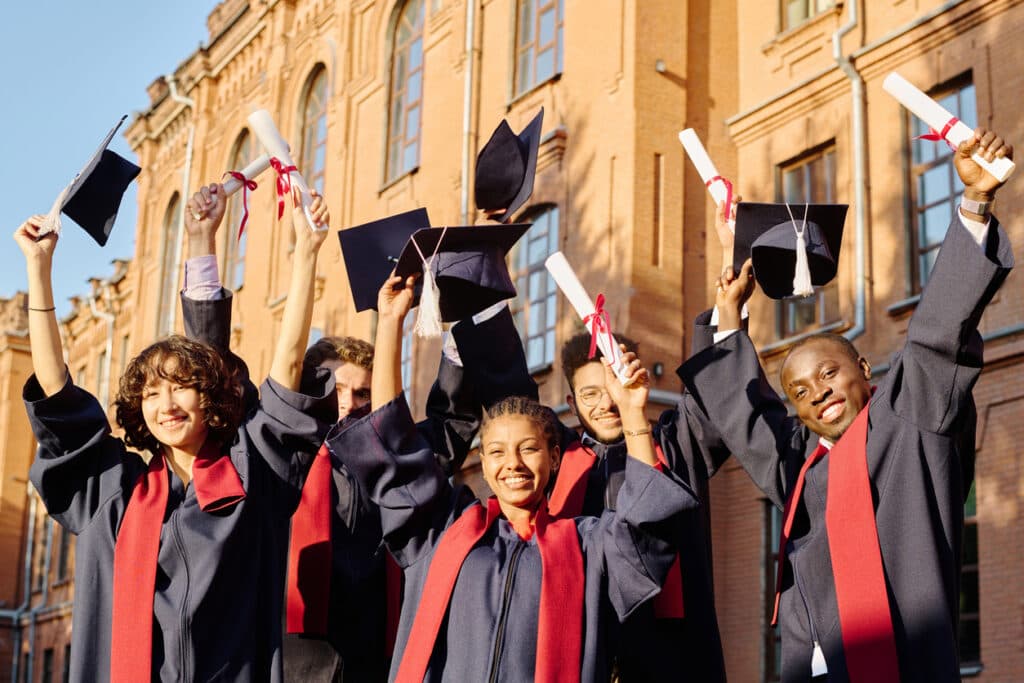 Graduates celebrating at a member school commencement